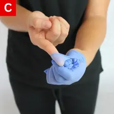 BBP Figure 5 C Peel the glove towards your fingers, encasing the first glove in it