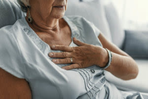 old-woman-holding-her-chest